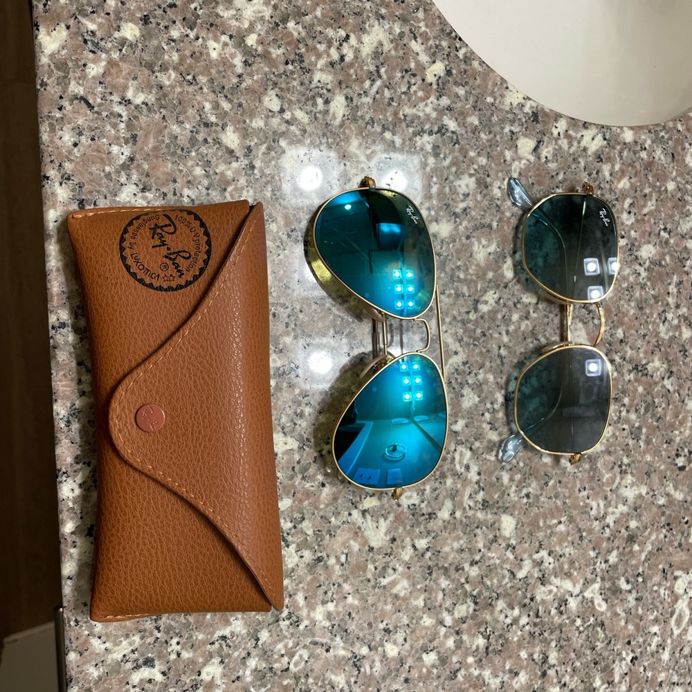 Brand new ray ban sun glasses $100 each pair if you buy both the case is free.